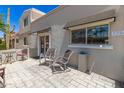 Relaxing front porch with chairs and table, perfect for enjoying the outdoors at 7736 E Rancho Vista Dr, Scottsdale, AZ 85251