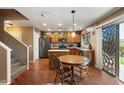 Charming kitchen with an island and breakfast table, complete with stainless steel appliances at 8259 W Carol Ave, Peoria, AZ 85345