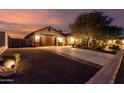 Beautiful exterior with long driveway, mature landscaping and a two-car garage at 12725 W Forest Pleasant Pl, Peoria, AZ 85383
