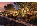 Desert landscaping in front yard, accented by a mature shade tree at 12725 W Forest Pleasant Pl, Peoria, AZ 85383