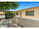 The property's exterior showcases lush landscaping and a private entrance at 1850 E Maryland Ave # 18, Phoenix, AZ 85016