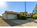 Charming single-story home features desert landscaping, attached garage, and a well-maintained front yard at 18842 N Lakeforest Dr, Sun City, AZ 85373