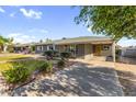 Beautiful single-story home boasts a xeriscaped front yard and covered parking at 2715 E Edgemont Ave, Phoenix, AZ 85008