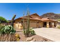 Charming single-story home featuring a three-car garage and drought-tolerant landscaping at 3028 W Parkside Ln, Phoenix, AZ 85027