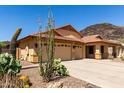 Charming single-story home featuring a three-car garage and drought-tolerant landscaping at 3028 W Parkside Ln, Phoenix, AZ 85027