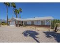 Well-maintained one-story home with a two-car garage and desert landscaping at 3362 E Carol Ave, Mesa, AZ 85204