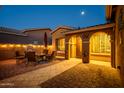 Enchanting courtyard with a beautiful brick patio, offering a perfect space for evening gatherings and relaxation at 42311 W Good Vibrations Ln, Maricopa, AZ 85138
