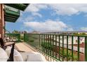 Relaxing balcony featuring stylish patio furniture, scenic city views, and green railings at 424 S 2Nd St # 306, Phoenix, AZ 85004