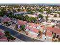 This bird's eye view shows a well-maintained neighborhood with tree-lined streets and Gathering homes at 579 N Mondel Dr, Gilbert, AZ 85233