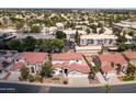 This aerial view highlights the neighborhood's mature landscaping and proximity to community amenities at 579 N Mondel Dr, Gilbert, AZ 85233