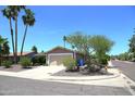 Charming home features low maintenance landscaping, mature trees, and a two-car garage at 6920 E Beverly Ln, Scottsdale, AZ 85254
