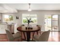 Cozy breakfast nook featuring a wooden table with seating, bright light and views to the backyard at 1245 W Lobo Ave, Mesa, AZ 85202