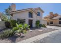Charming stucco home featuring a tile roof, desert landscaping, and a welcoming front entrance at 1320 N Brittany Ln, Gilbert, AZ 85233