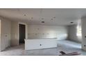 Bright living room with smooth concrete floors and neutral walls, providing ample space and natural light at 15785 W Beryl Ave, Waddell, AZ 85355