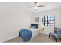 Serene bedroom with light, bright window and comfortable, patterned chair at 16421 N 65Th Pl, Scottsdale, AZ 85254