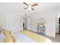 Cozy bedroom with ceiling fan, neutral carpet, and charming decor at 16421 N 65Th Pl, Scottsdale, AZ 85254