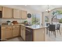 Well-lit kitchen with granite countertops, stainless steel appliances, and an adjacent breakfast nook with ample seating at 17141 E Rockwood Dr, Fountain Hills, AZ 85268