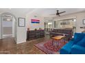 Open-concept living room featuring stylish decor and access to a patio and dining area at 1880 E Morten Ave # 125, Phoenix, AZ 85020