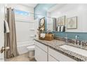Bright bathroom with a granite countertop, white cabinets, and a shower-tub combination at 18812 E Bruno Dr, Gold Canyon, AZ 85118