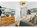 Stylish bedroom with a modern design, large mirror, and unique decor at 18812 E Bruno Dr, Gold Canyon, AZ 85118