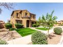 Inviting two-story home with landscaped front yard and covered driveway at 20366 E Via De Colina --, Queen Creek, AZ 85142