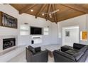 Spacious living room with fireplace, entertainment center, recessed lighting, and comfortable seating at 2132 E Northview Ave, Phoenix, AZ 85020
