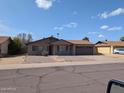 Charming single-story home with gravel landscaping and a two-car garage at 2179 E Palmcroft Dr, Tempe, AZ 85282