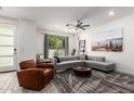 Bright living room featuring modern furnishings, ceiling fan, and sliding glass door at 300 N Gila Springs Blvd # 181, Chandler, AZ 85226