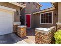 Charming front entrance featuring a vibrant red door, brick accents and well maintained yard at 4123 S Wayne Pl, Chandler, AZ 85249