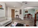 Inviting living room with wood floors, neutral color palette, and easy access to dining room at 4123 S Wayne Pl, Chandler, AZ 85249