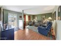 Cozy living room with warm wood floors and a comfortable seating area at 4418 W Palo Verde Ave, Glendale, AZ 85302