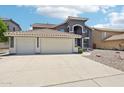 Spacious three-car garage and attractive home with low-maintenance desert landscaping at 553 E Baylor Ln, Gilbert, AZ 85296