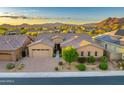 Inviting single-Gathering home with manicured landscaping, a brick driveway, and a two-car garage at 5626 E Sleepy Ranch Rd, Cave Creek, AZ 85331