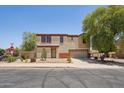 Charming two-story home with desert landscaping and a two-car garage, nestled on a tree-lined street at 7501 S 14Th St, Phoenix, AZ 85042