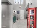 Bright foyer boasting tile floors, high ceilings and views to the upper level at 868 W Desert Glen Dr, San Tan Valley, AZ 85143