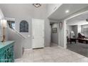 Bright foyer features tile floors, neutral paint, and staircase to the upper level at 868 W Desert Glen Dr, San Tan Valley, AZ 85143