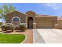 Charming home featuring desert landscaping, paver driveway, and a neutral color palette at 871 E Melanie St, San Tan Valley, AZ 85140