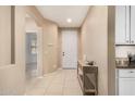 Bright foyer featuring neutral walls, tiled floors, and modern decor at 12023 W Duane Ln, Peoria, AZ 85383