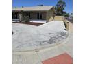 Residential home showcasing a concrete driveway and landscaped areas on the side of the property at 13801 N 37Th Dr, Phoenix, AZ 85053