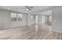 Bright living room featuring neutral colors, tile floors, and large windows at 1848 S Follett Way, Gilbert, AZ 85295