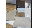 Selection of interior finish materials, including flooring, tiling, and cabinetry samples displayed at 20025 W Campbell Ave, Buckeye, AZ 85396