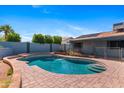 Beautiful backyard oasis with a sparkling pool, spacious patio, and tranquil atmosphere at 2114 E Sesame St, Tempe, AZ 85283
