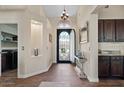 Elegant foyer features dark wood accents, granite countertops, and designer lighting at 22634 N 47Th Pl, Phoenix, AZ 85050