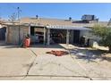 Spacious backyard area featuring a large patio perfect for entertaining, with mature landscaping and a storage shed at 2310 N 40Th Dr, Phoenix, AZ 85009