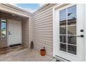 Inviting entrance featuring white doors, neutral siding, and decorative accents at 3301 S Goldfield Rd # 1046, Apache Junction, AZ 85119