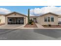Inviting single-story home featuring an open garage, low maintenance landscaping, and desert foliage at 3301 S Goldfield Rd # 1046, Apache Junction, AZ 85119