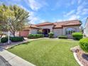 Lovely single-Gathering home with an immaculate front lawn, mature tree, and tile roof in a desirable neighborhood at 3702 N 160Th Ave, Goodyear, AZ 85395