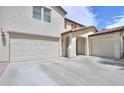 Beautiful home with a three-car garage and a spacious driveway for multiple vehicles at 40232 W Marion May Ln, Maricopa, AZ 85138