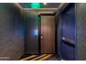 Hallway featuring modern design with the unit number displayed and a door to enter the condo at 4422 N 75Th St # 8004, Scottsdale, AZ 85251