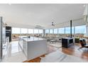 Bright, open living area with modern finishes, a fireplace, and floor-to-ceiling windows showcasing city views at 4422 N 75Th St # 8004, Scottsdale, AZ 85251